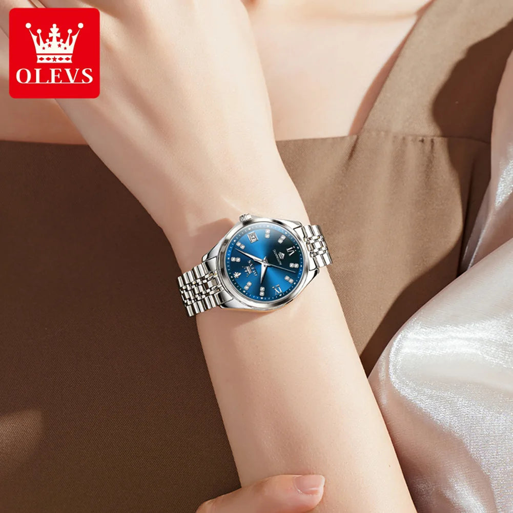 Elegant women's stainless steel mechanical watch with a blue dial, diamond markers and a polished metal strap.