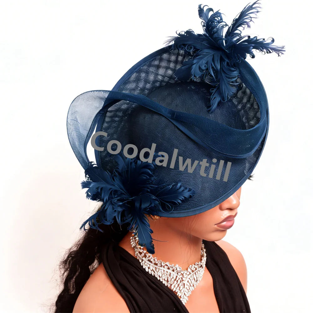 Elegant navy blue fascinator featuring structured mesh netting, sculptural swooping curves, and feather accents.