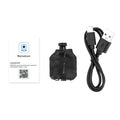 Black mini security camera with lens, a black USB charging cable, and a white paper installation manual.