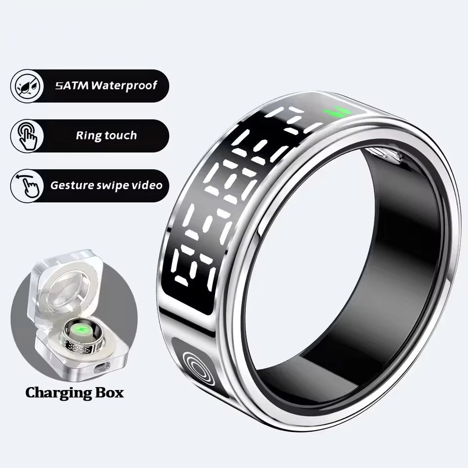Sleek silver smart health ring with digital display, touch controls, waterproof rating and included charging case.