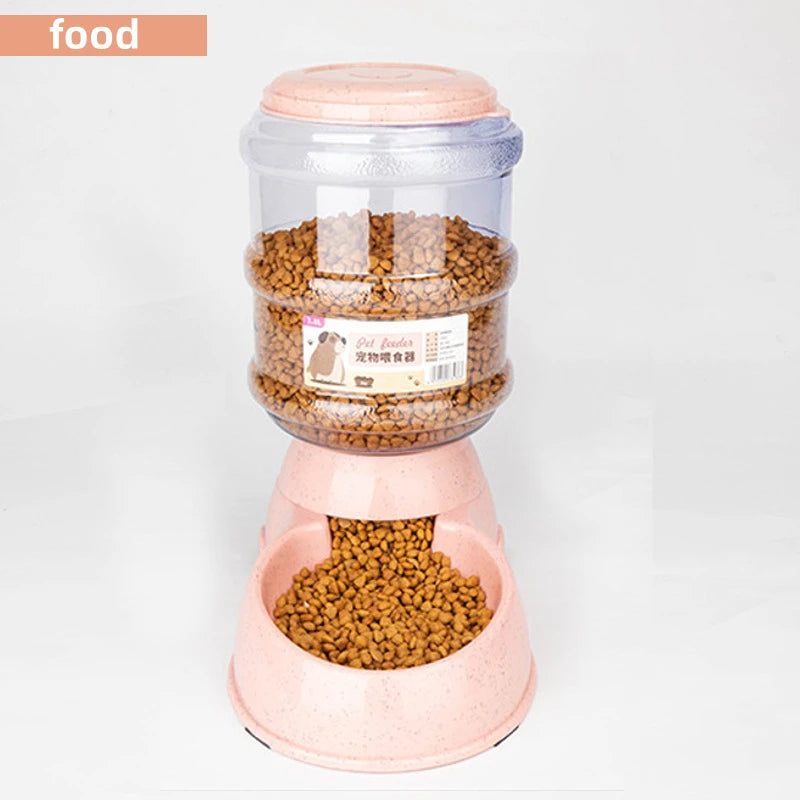 Automatic pet feeder in speckled pastel pink with a clear plastic food storage tank filled with brown kibble.