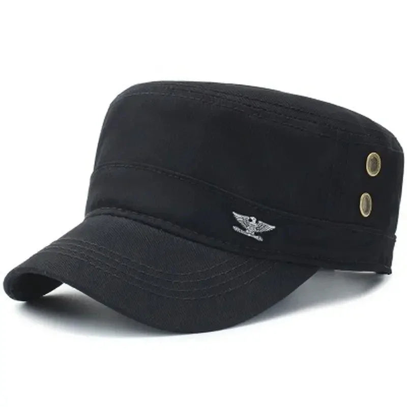 Black cotton military-style cadet cap with a flat top, stiff peak, side eyelets, and a small silver eagle emblem.