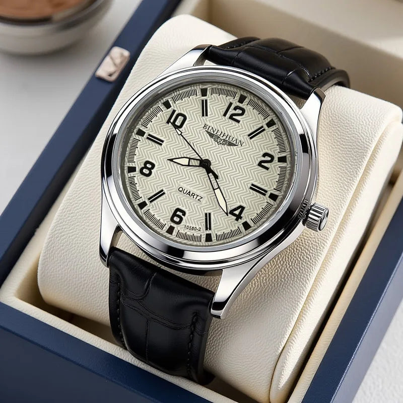 Men's quartz watch with a silver case, cream chevron-patterned dial, and a black embossed leather strap in a gift box.