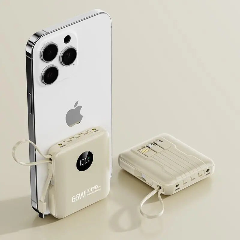 Beige 50,000mAh portable power bank with built-in charging cables, LED battery display, and integrated carry loop.