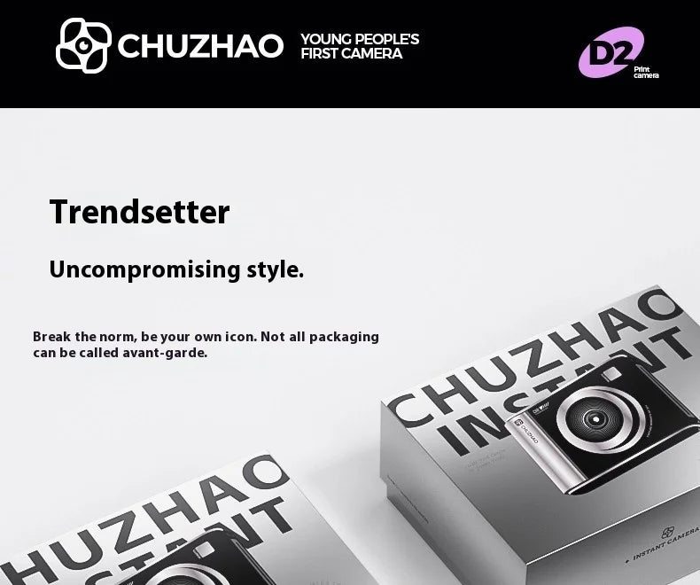 Black and silver Chuzhao D2 instant camera in branded grey packaging with a white label showing the camera design.