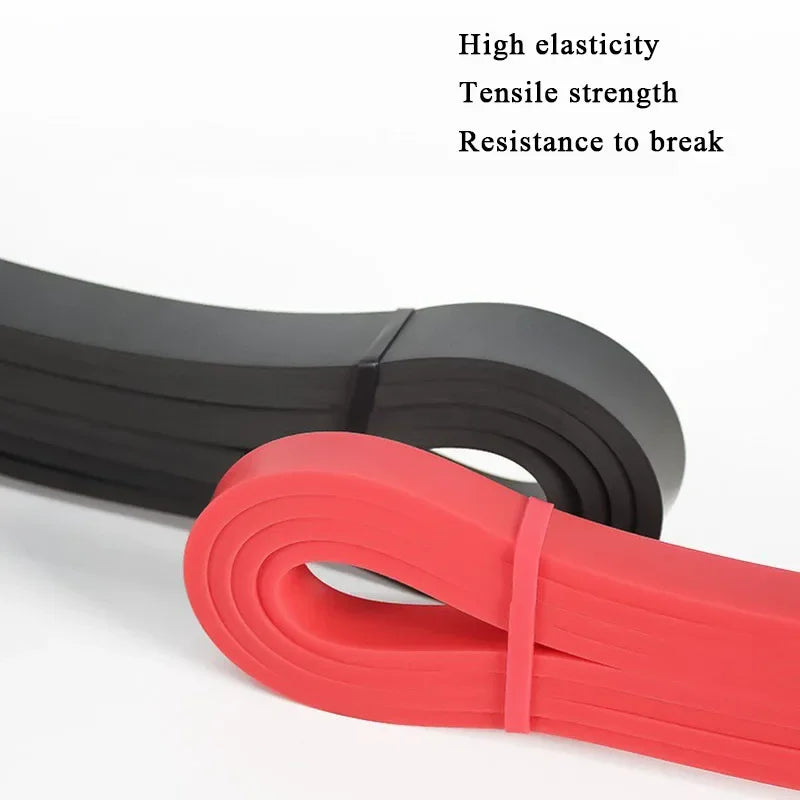 Two coiled resistance bands in red and black, set against a plain white background with text features above.