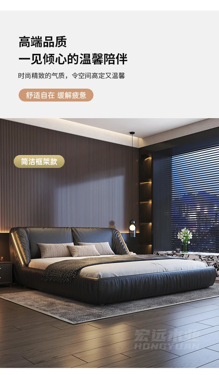 Modern charcoal grey upholstered king-size bed frame with a sleek, curved headboard in a contemporary bedroom.