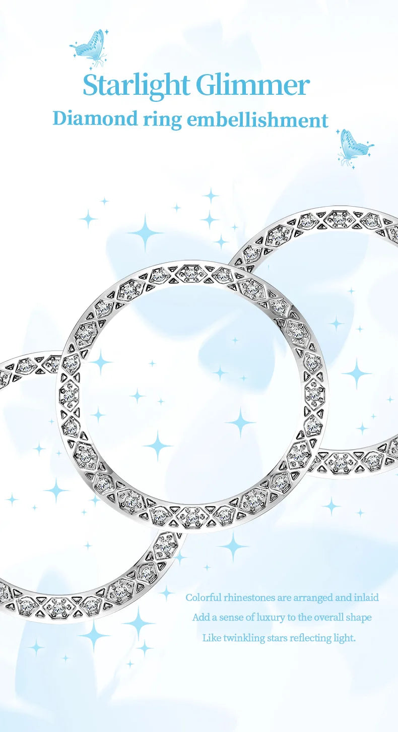 Close-up of a silver watch bezel featuring intricate geometric patterns set with sparkling, diamond-like crystals.