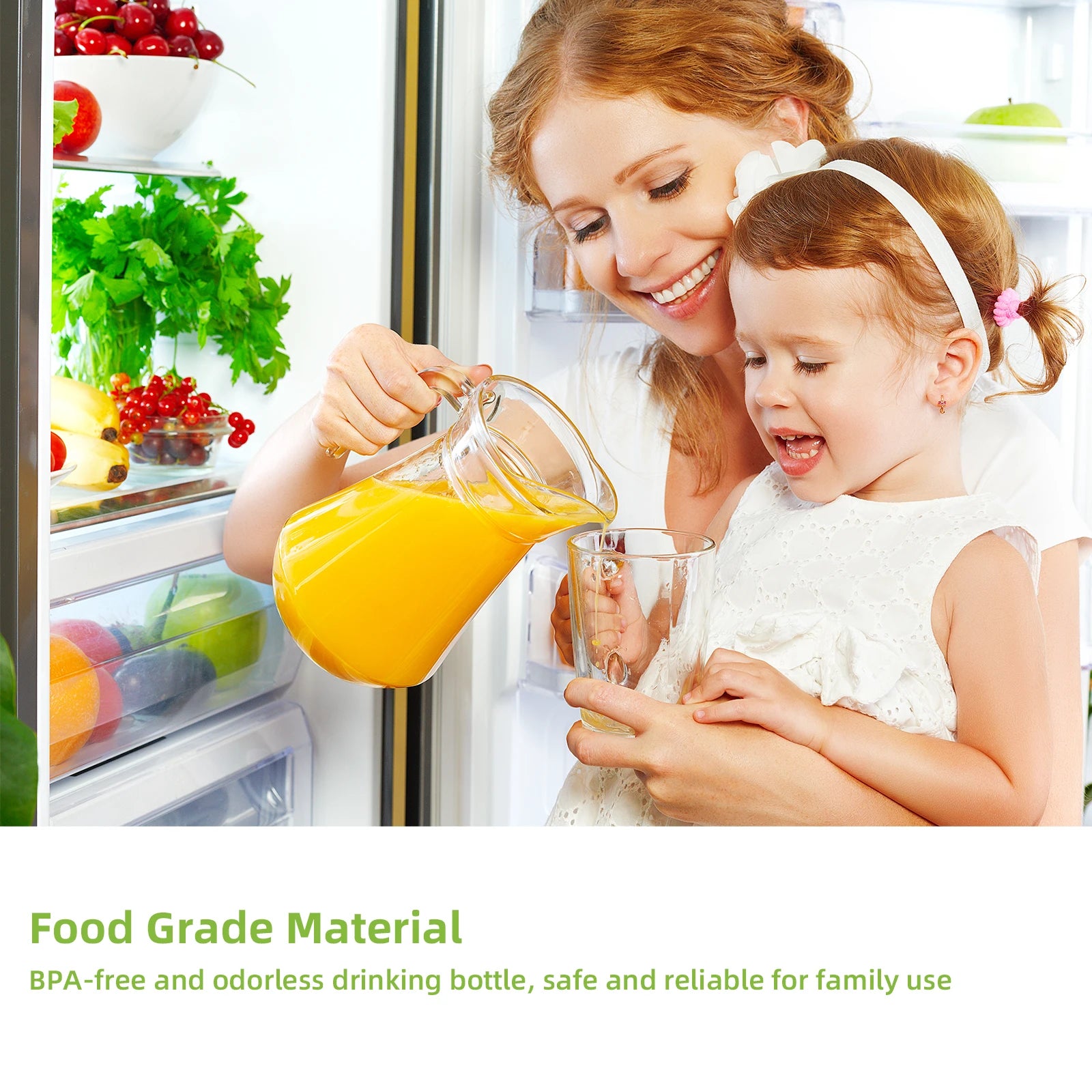 A clear glass pitcher pouring orange juice into a glass, held by a woman with her young daughter.