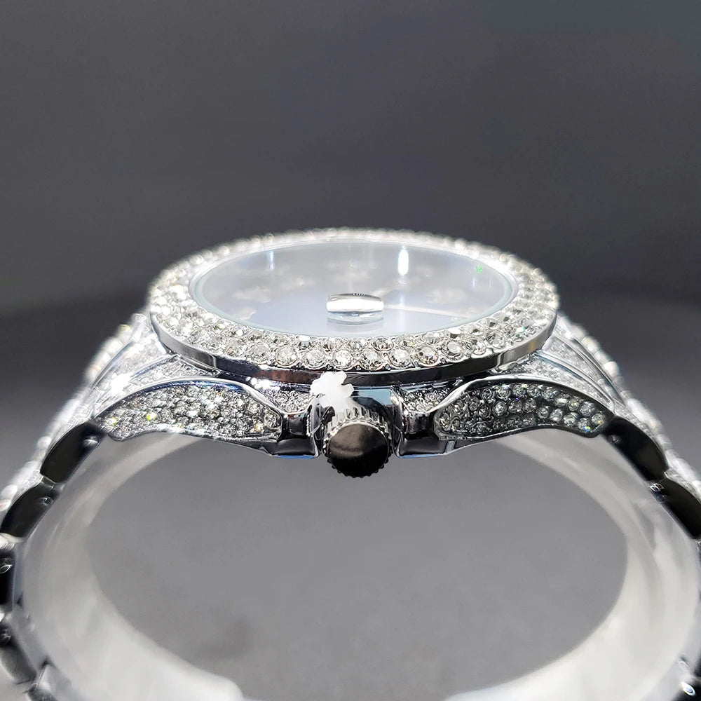 Elegant silver-tone women's dress watch, heavily encrusted with sparkling crystals on the bezel and bracelet.