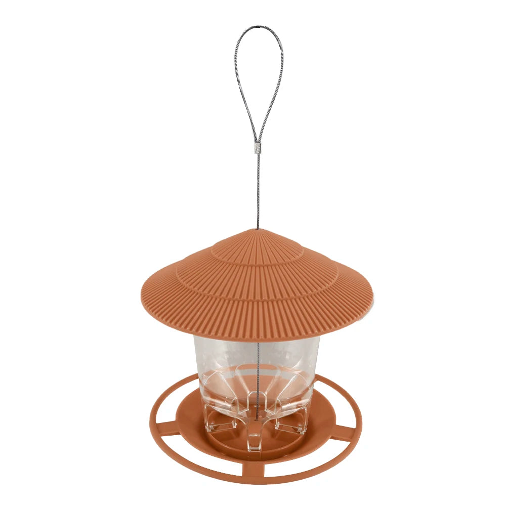 Hanging bird feeder with a terracotta-colored, ribbed, cone-shaped roof and a clear reservoir for birdseed.