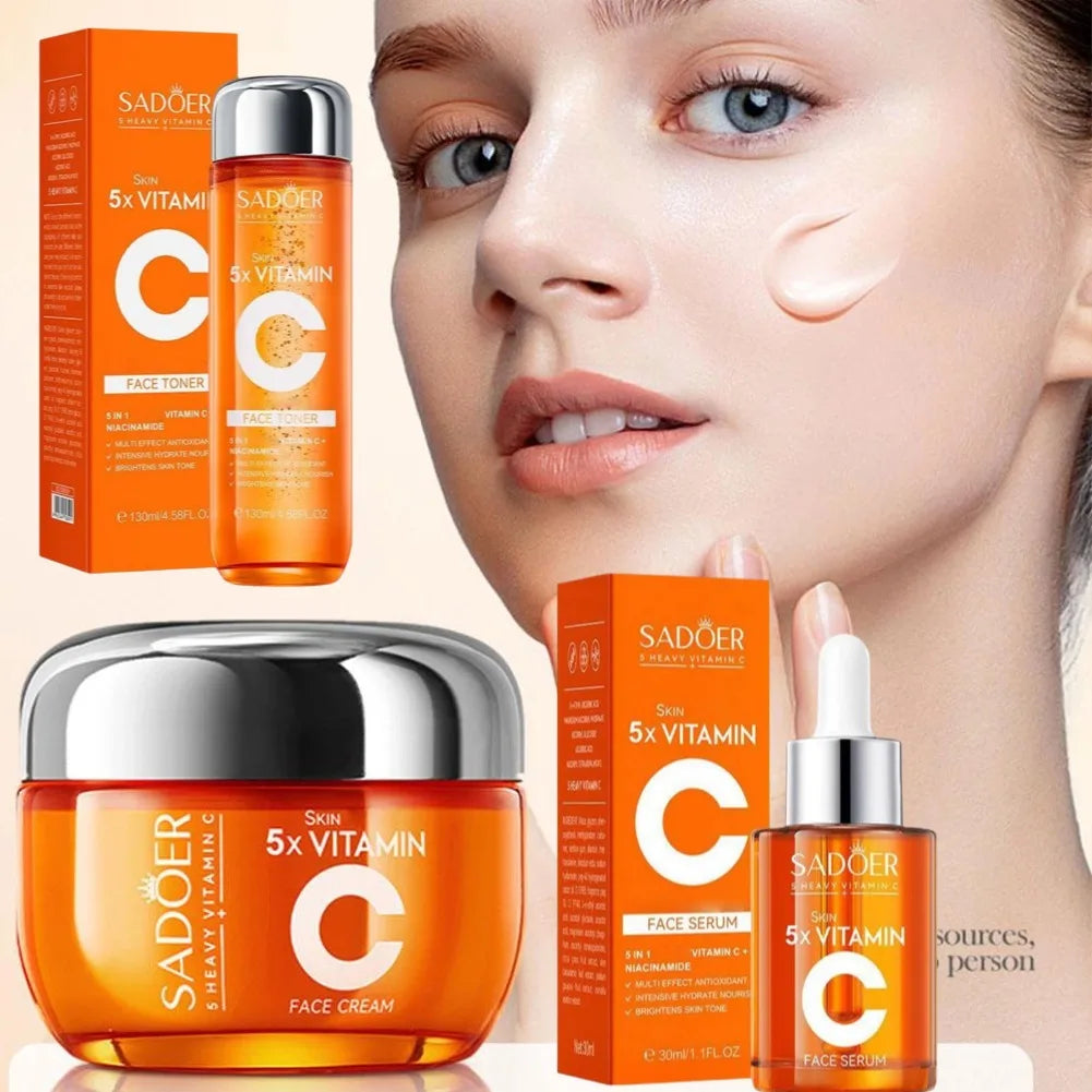 Vitamin C face toner, serum, and cream set in orange packaging, shown next to a woman with smooth, radiant skin.