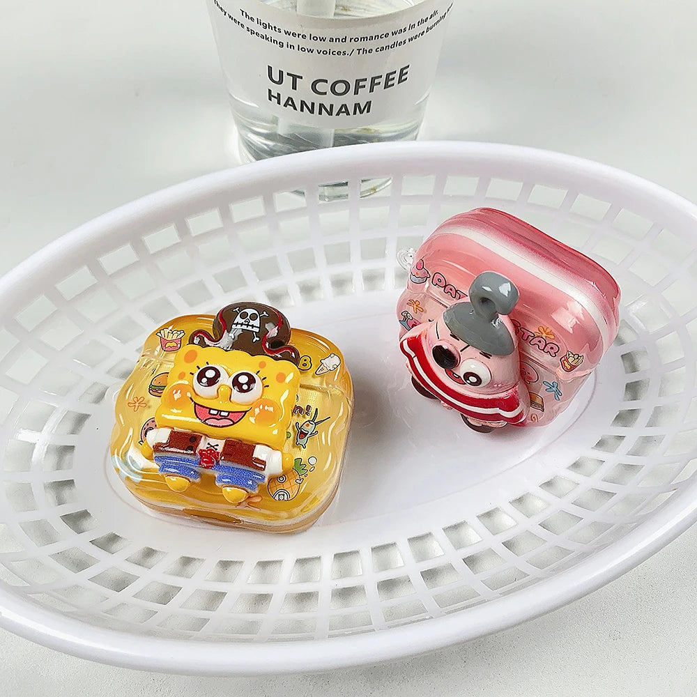 Two glossy, character-themed silicone AirPods cases in yellow and pink, featuring SpongeBob and Patrick designs.