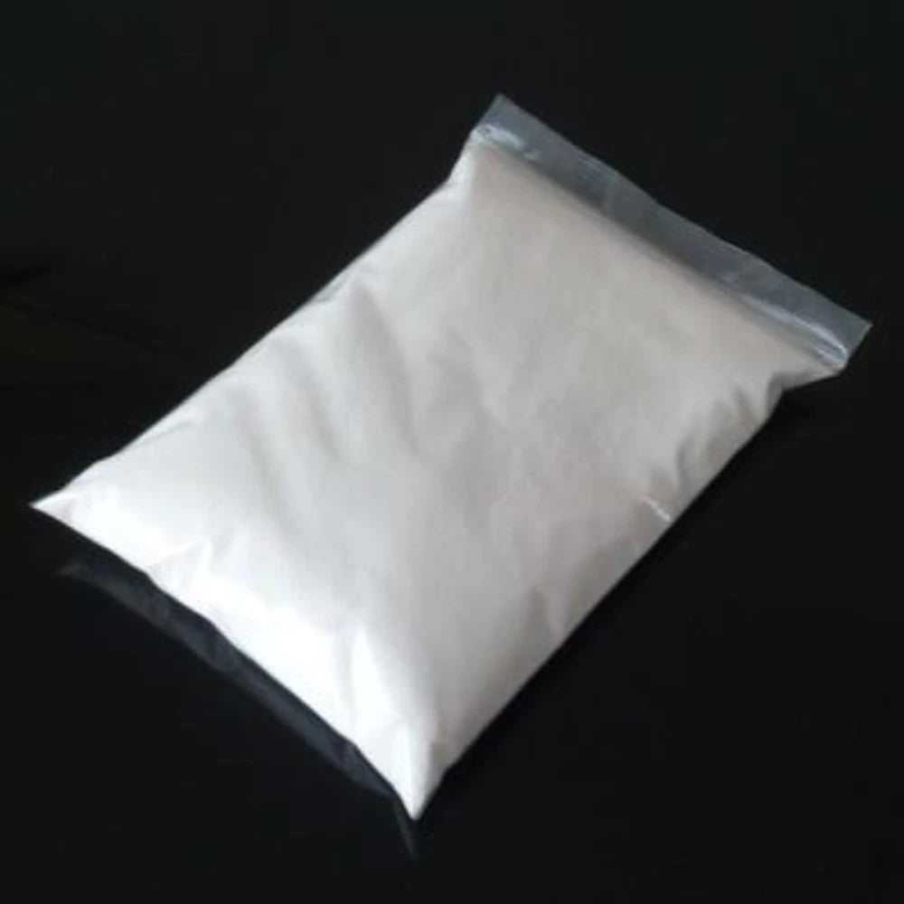 500g bag of white magic slush powder in a clear, sealed plastic pouch on a black background.