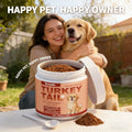 A tub of turkey tail bacon-flavoured probiotic powder for dogs, with a small scoop, next to a woman hugging her dog.