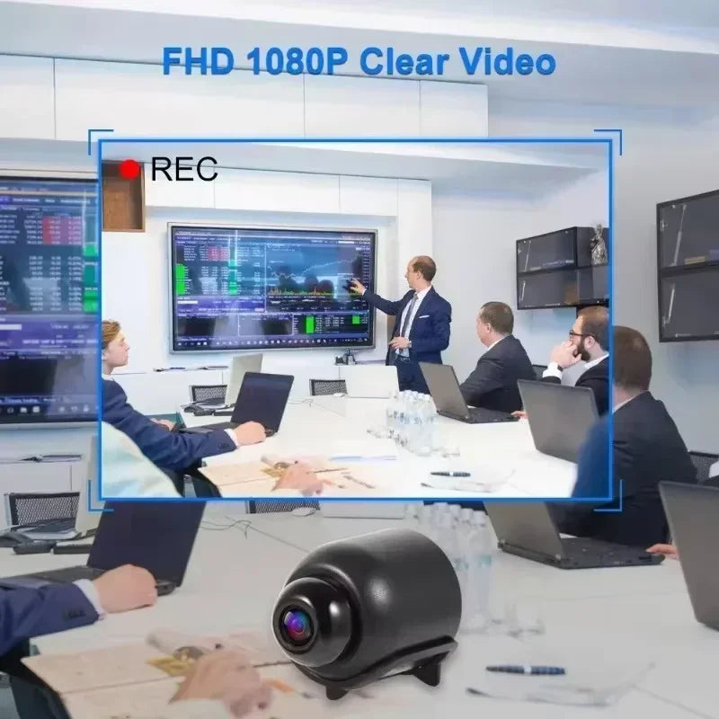 Small black plastic security camera shown in the foreground with a 1080p video feed of a business meeting.