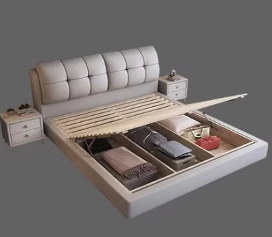Minimalist grey queen bed frame with a tufted headboard, slatted base and integrated ottoman storage, plus side tables.