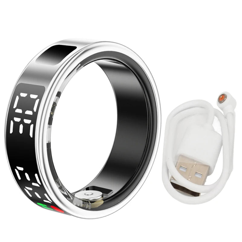 Sleek silver smart fitness ring with a digital display and black inner lining, plus a white magnetic charging cable.
