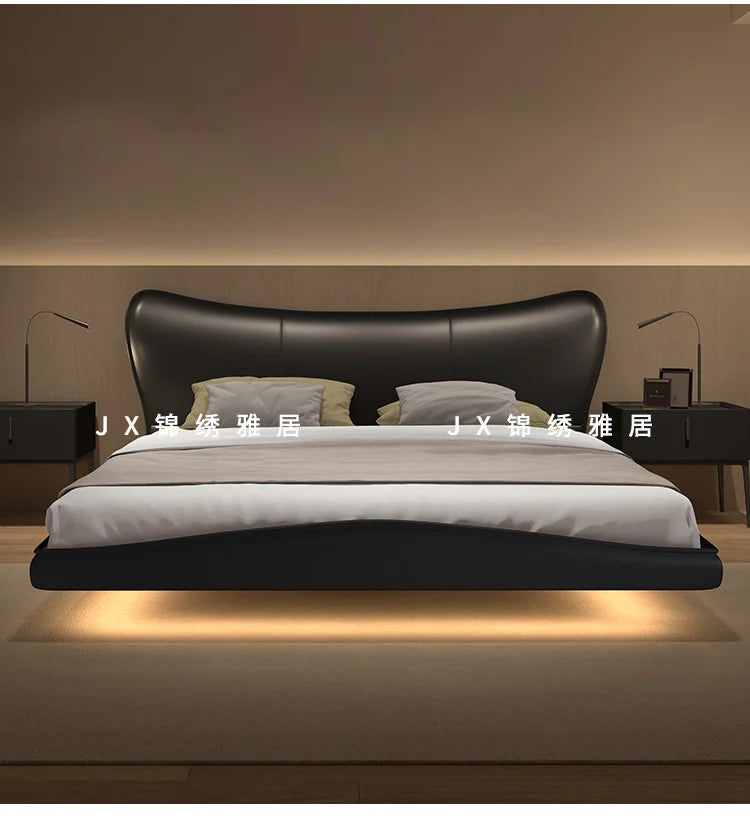 Modern black upholstered floating bed frame with a curved headboard and integrated under-bed lighting.