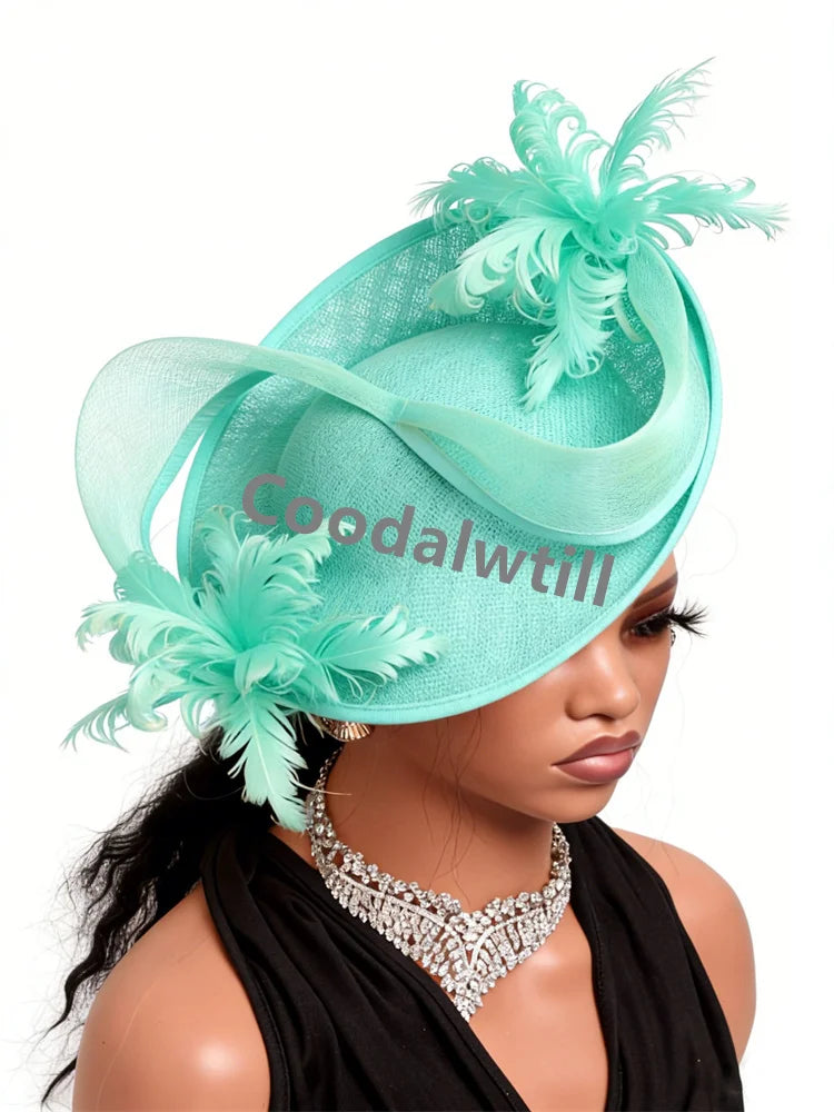 Elegant mint green fascinator hat with decorative sinamay loops and delicate feathers, worn on a mannequin.