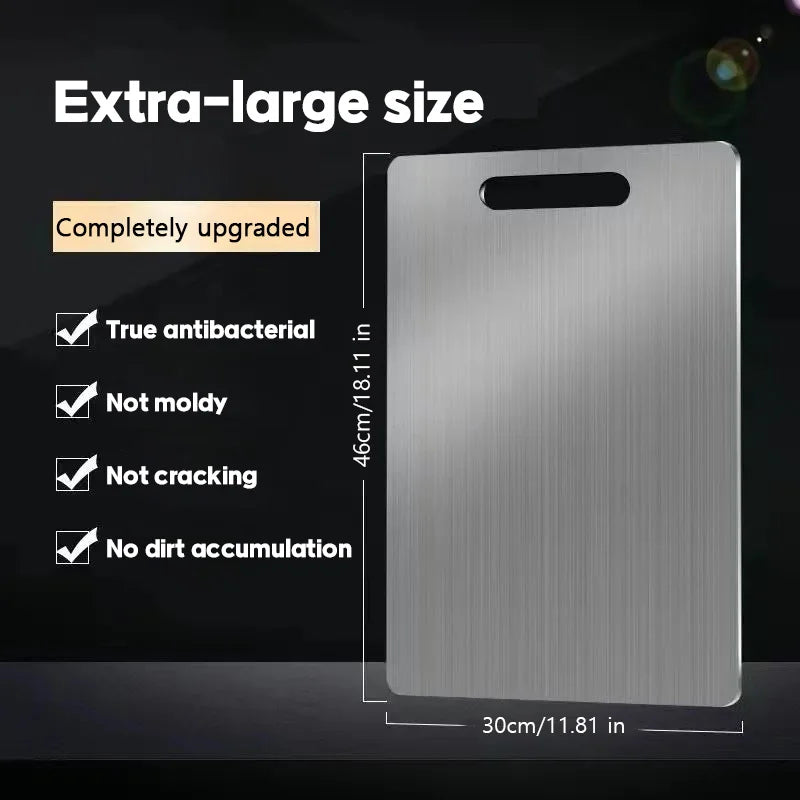 Rectangular stainless steel cutting board with handle cutout, measuring 46x30cm, with promotional text.