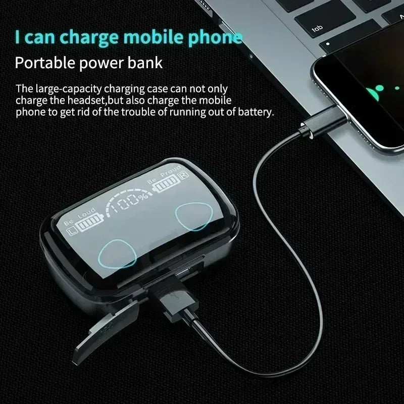 Black portable earbud charging case with a digital battery display, plugged into and charging a smartphone.