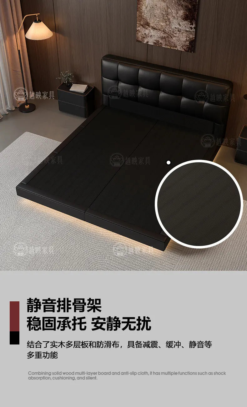 Modern black leather double bed with a tufted headboard and integrated under-bed lighting, creating a floating effect.