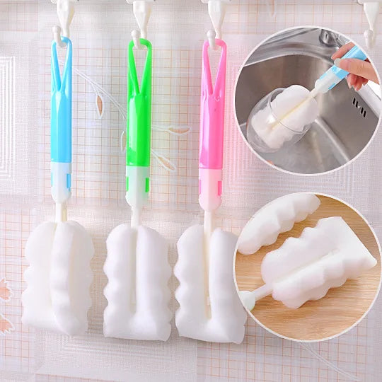 Three cup brushes with blue, green, and pink handles and white, ridged foam heads, shown hanging and in use.