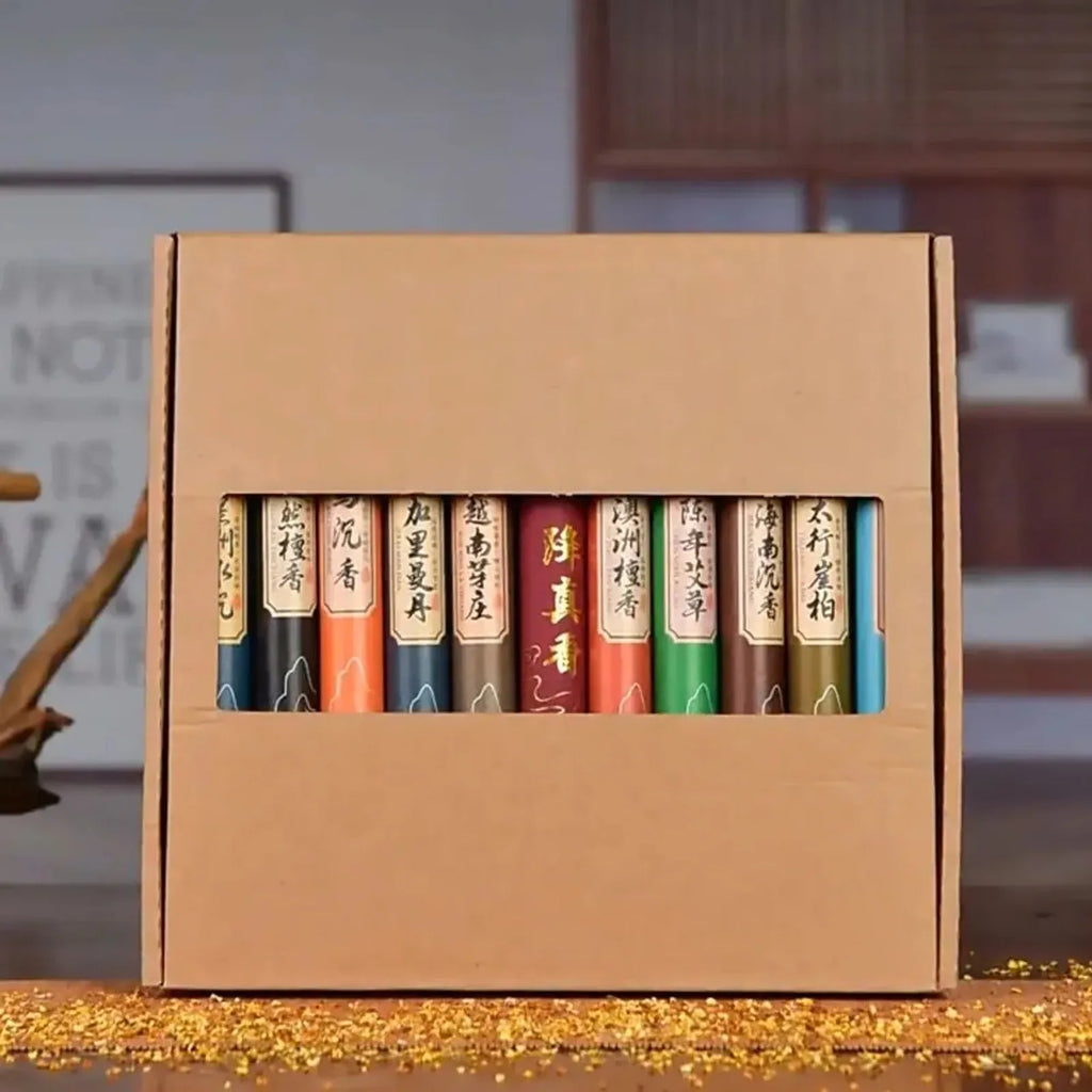 A cardboard gift box containing ten multi-coloured incense tubes, each featuring elegant gold Chinese calligraphy.