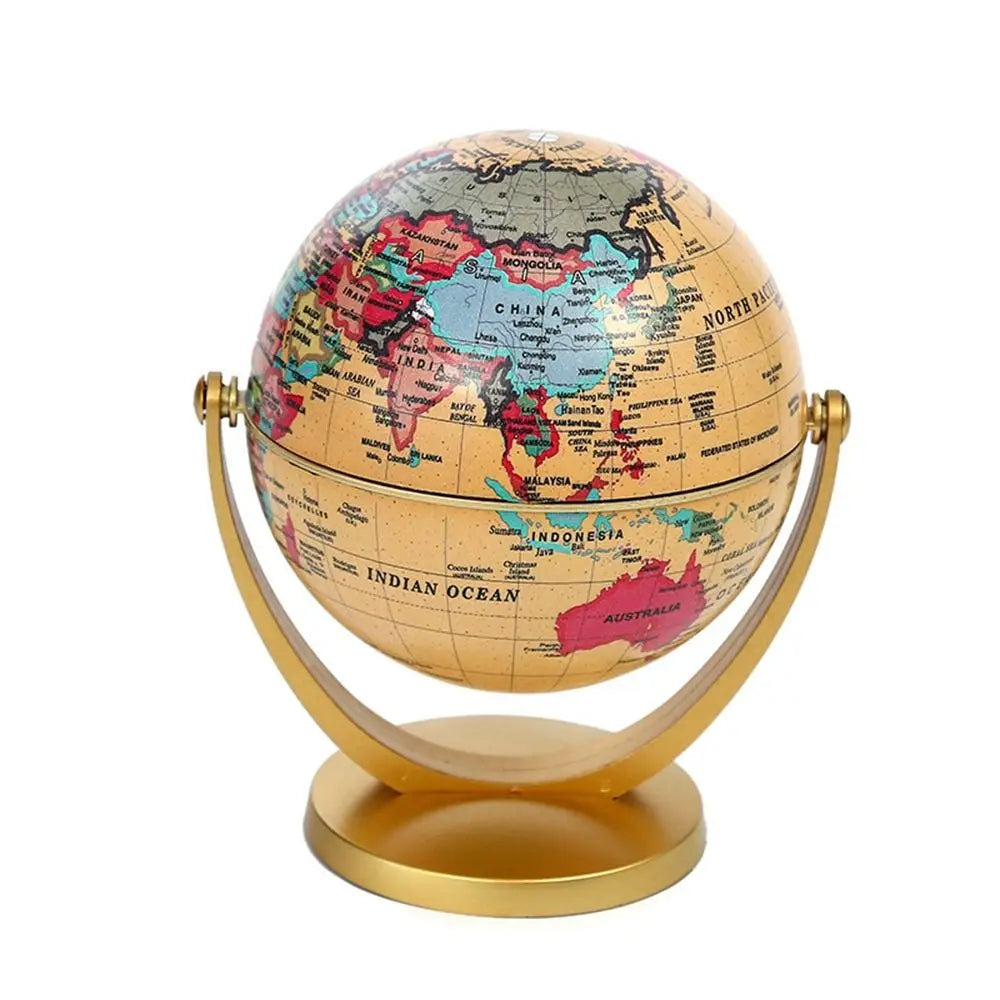 Desktop globe featuring a vintage-style tan map and colorful countries on a gold metal swivel stand.