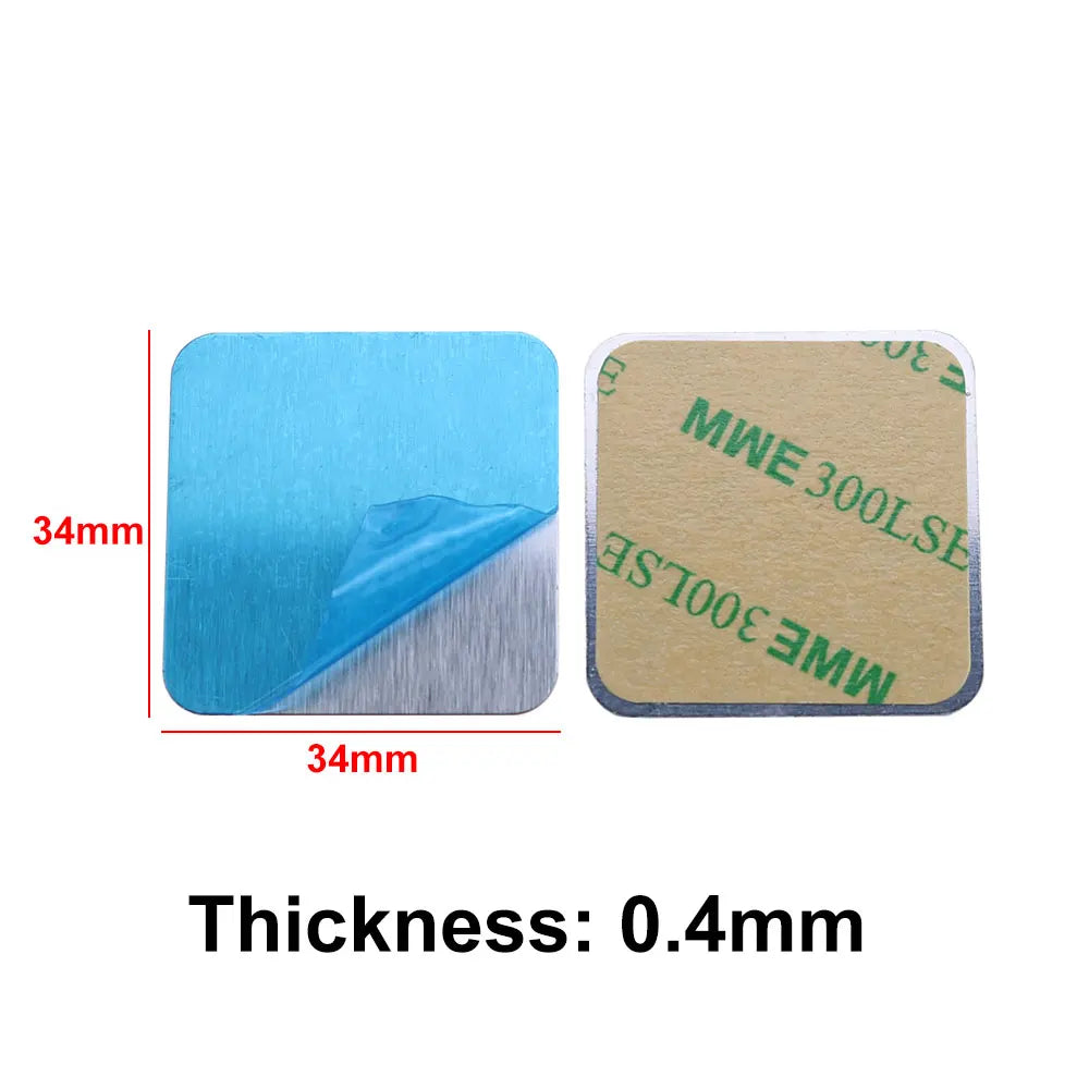 Two square 34mm metal adhesive pads with protective blue film and adhesive backing. 0.4mm thickness.