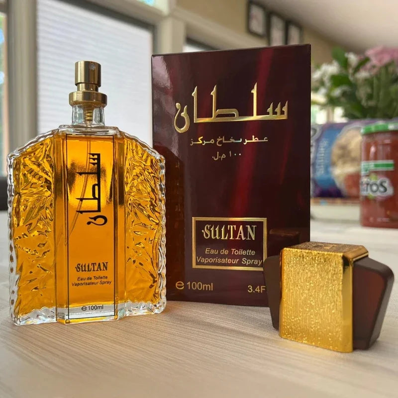 Gold Sultan 100ml eau de toilette spray bottle with ornate glass, matching cap, and burgundy box.