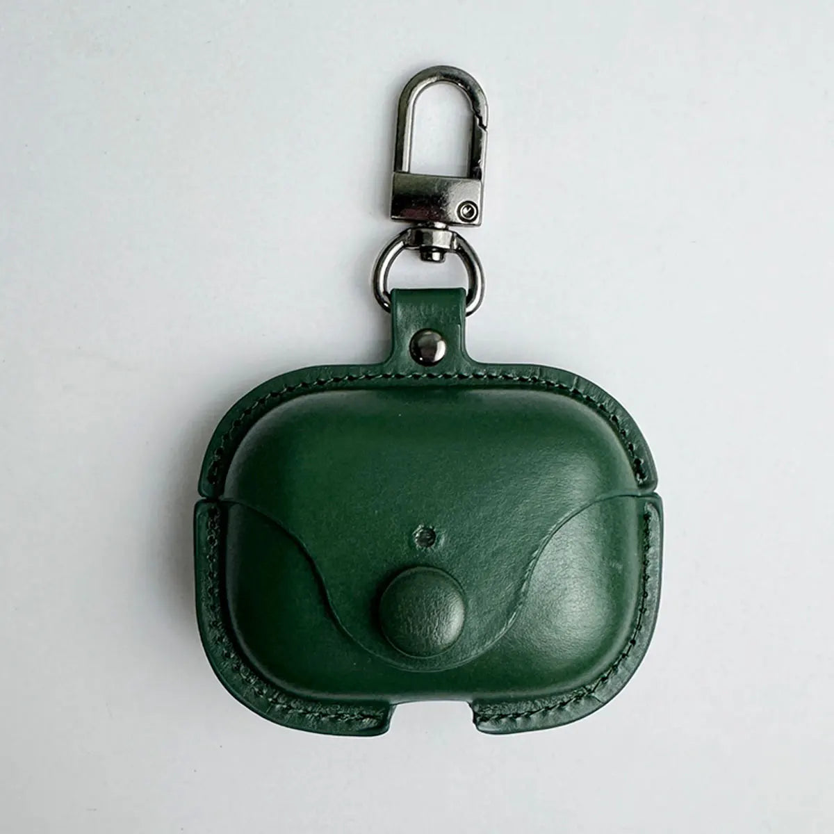 Dark green leather AirPods Pro case with a press-stud flap closure and metal keychain clip.
