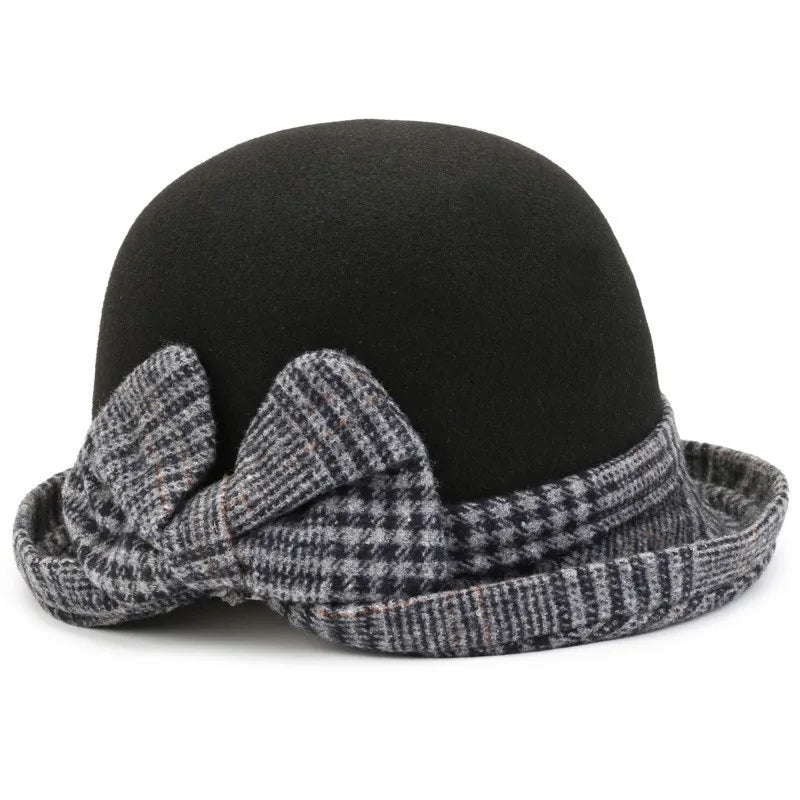 Black felt winter bucket hat with a grey and black tartan brim and a decorative side bow.