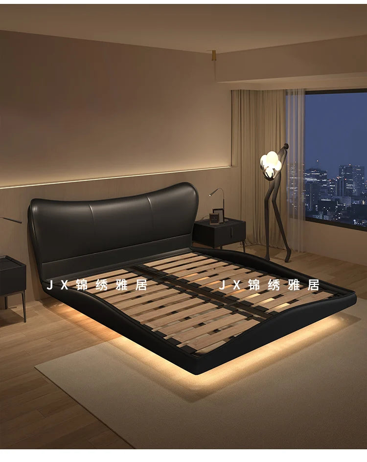 Modern black upholstered bed frame with a curved headboard, wooden slats and integrated under-bed lighting.
