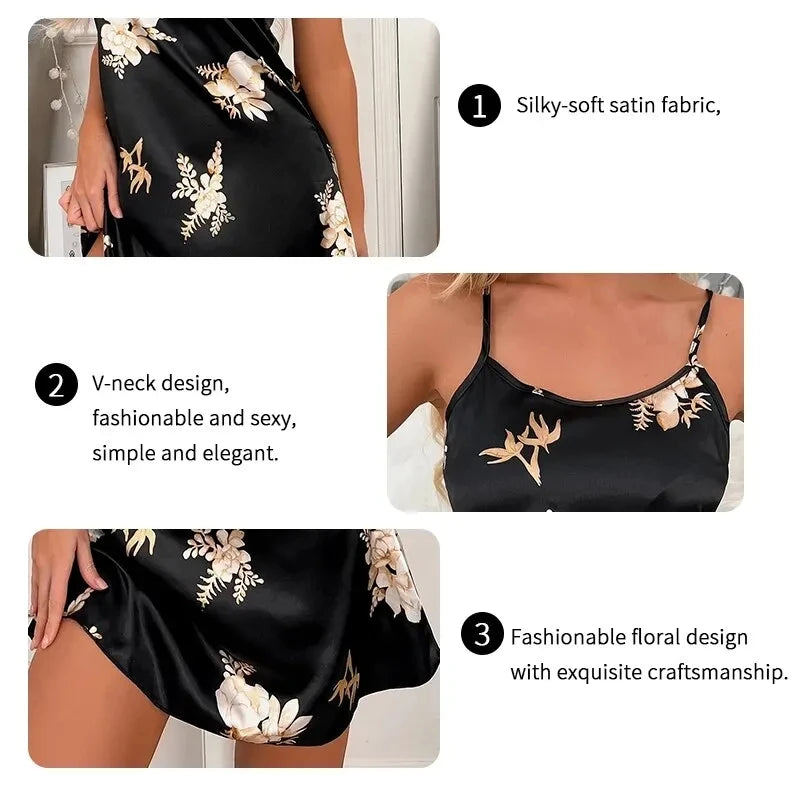 Black satin camisole dress with V-neckline and elegant floral print, featuring a soft, silky finish.