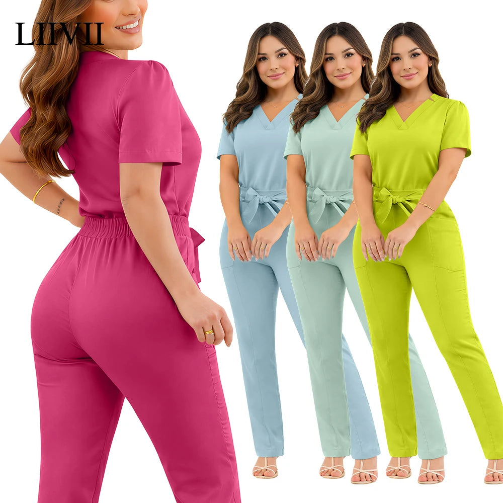 A woman models professional scrub sets with V-necks, tie-waists, and slim-fit trousers in pink, blue, mint, and lime.