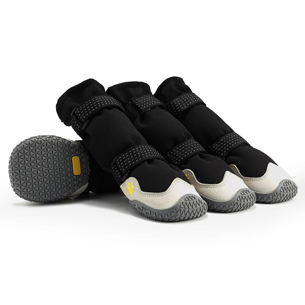 Black waterproof dog boots with grey anti-slip soles, reinforced toes, and adjustable reflective velcro straps.