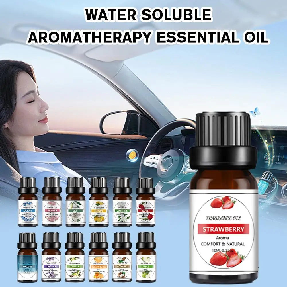 A 10ml amber glass dropper bottle of Strawberry fragrance oil beside a row of varied essential oil bottles.