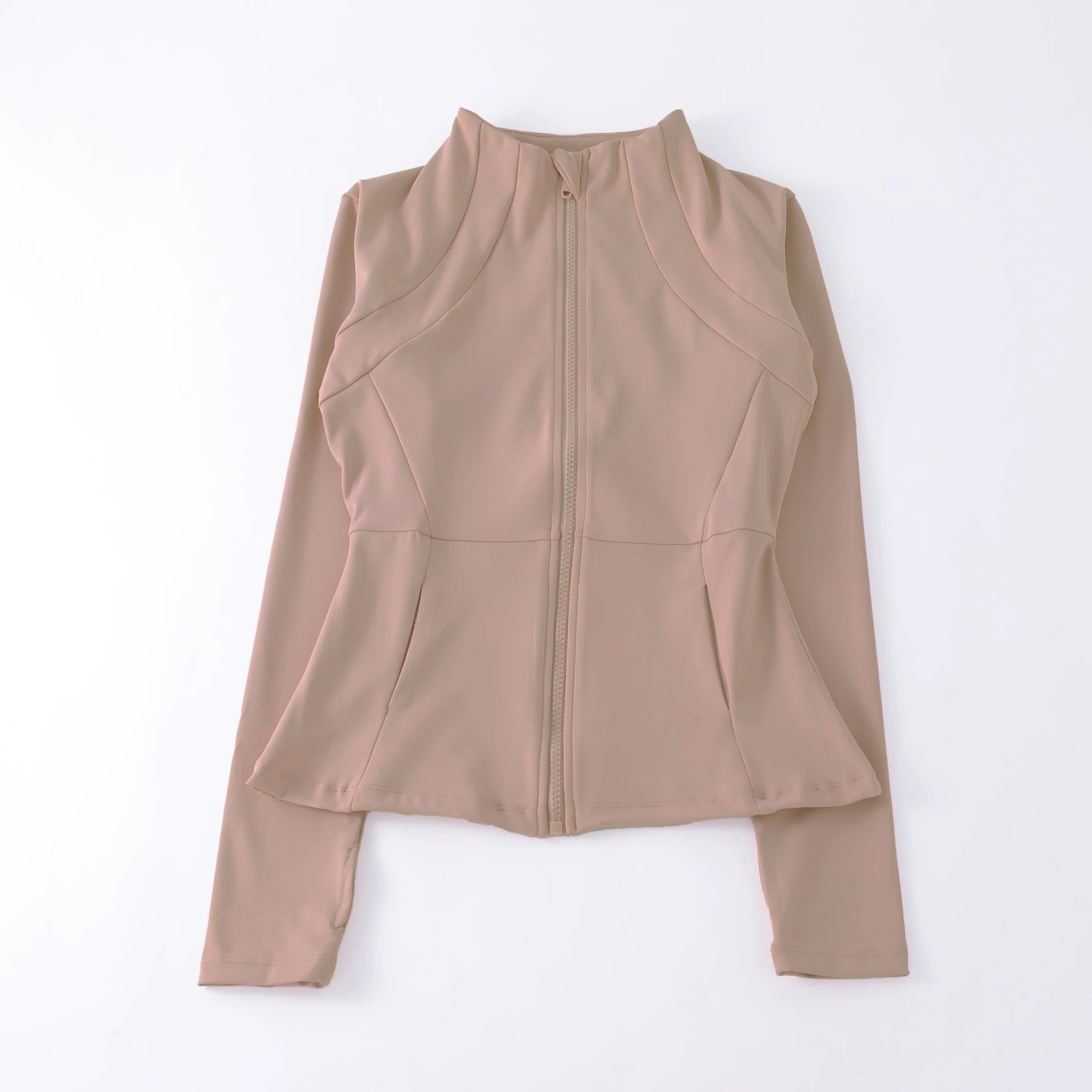 Beige long-sleeved zip-up sports jacket with a high neck, fitted silhouette, and flared peplum waist.