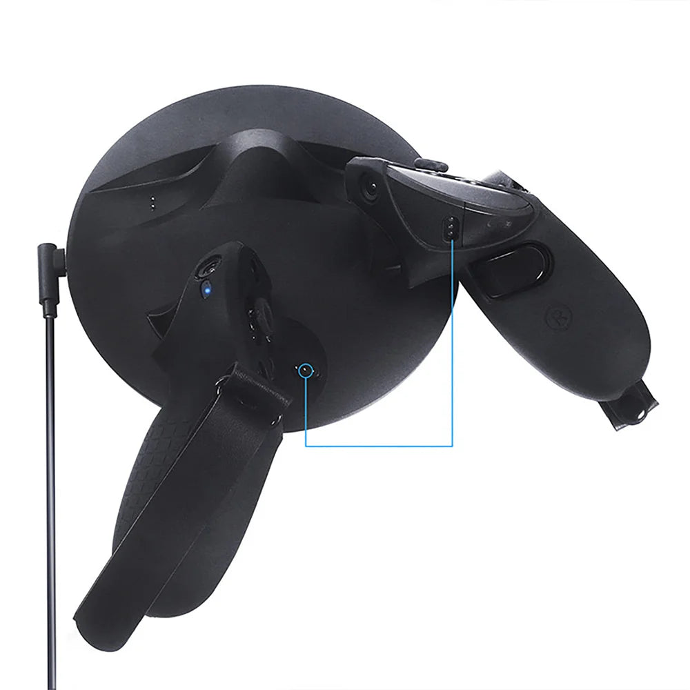 Black protective silicone grip covers with adjustable hand straps on two VR touch controllers and a round charging dock.