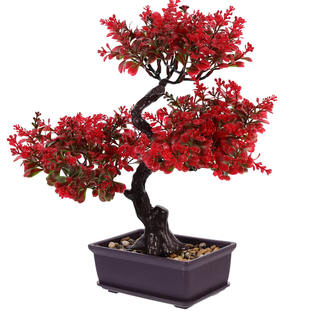 Artificial bonsai tree with vibrant red leaves, dark twisted trunk, and pebbled soil in a rectangular black pot.