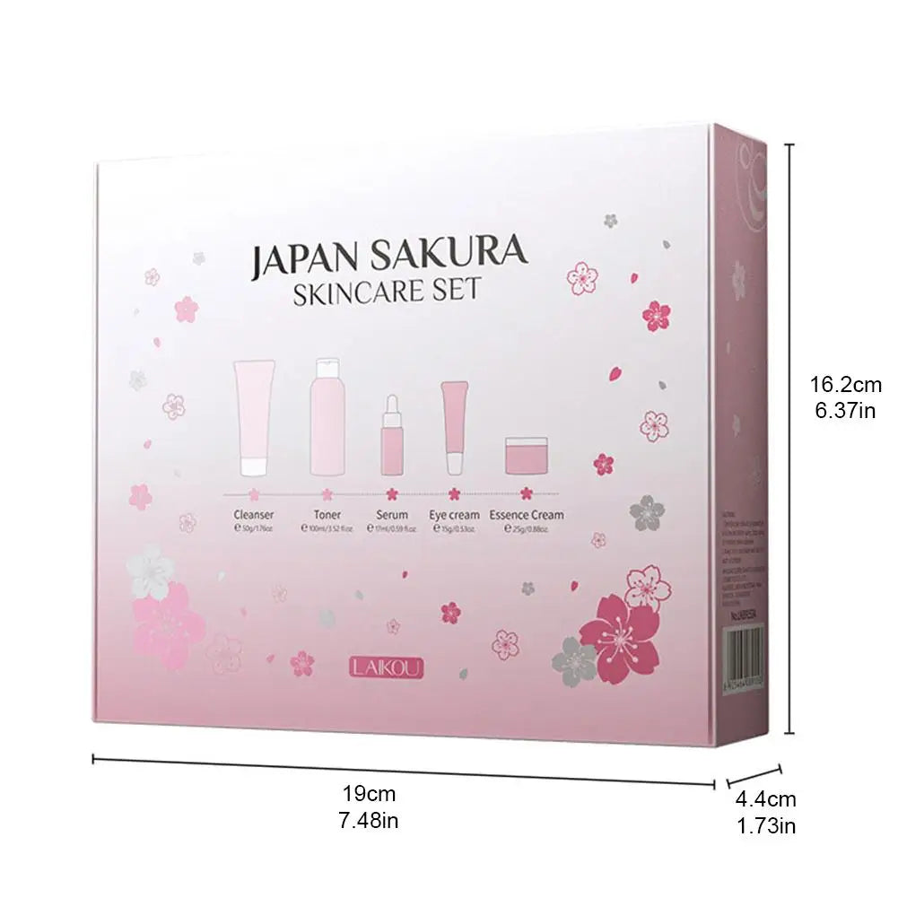 Sakura-themed skincare set in a pink box, featuring cleanser, toner, serum, eye cream, and essence cream.