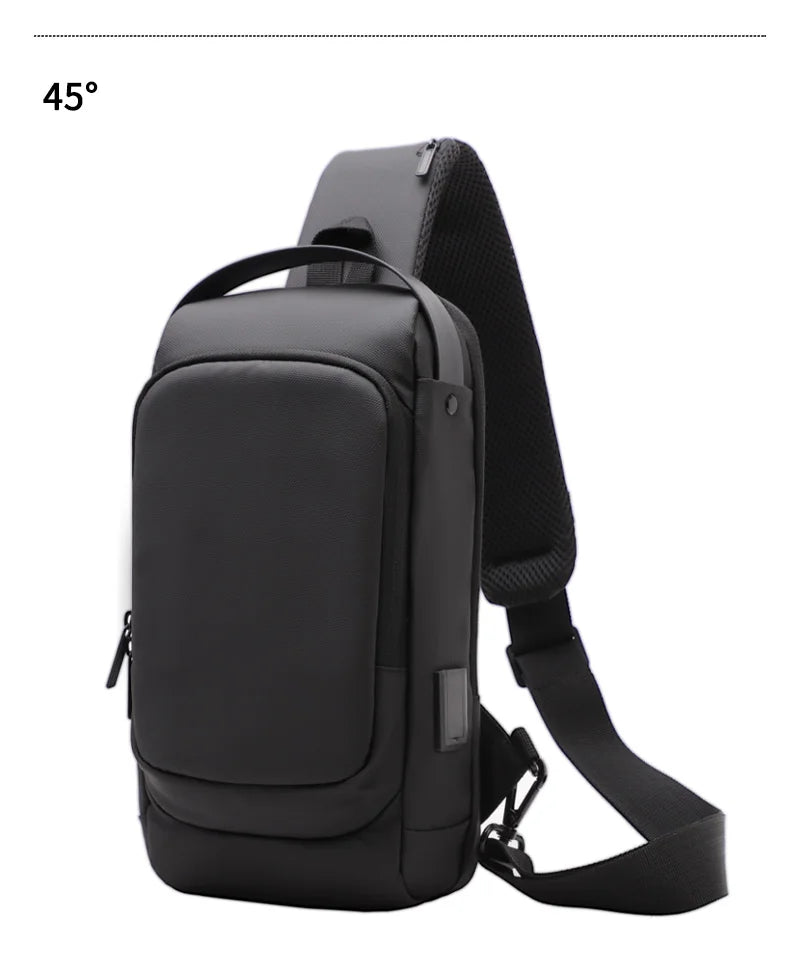 Black waterproof crossbody sling bag with a padded shoulder strap, top handle, and built-in USB charging port.