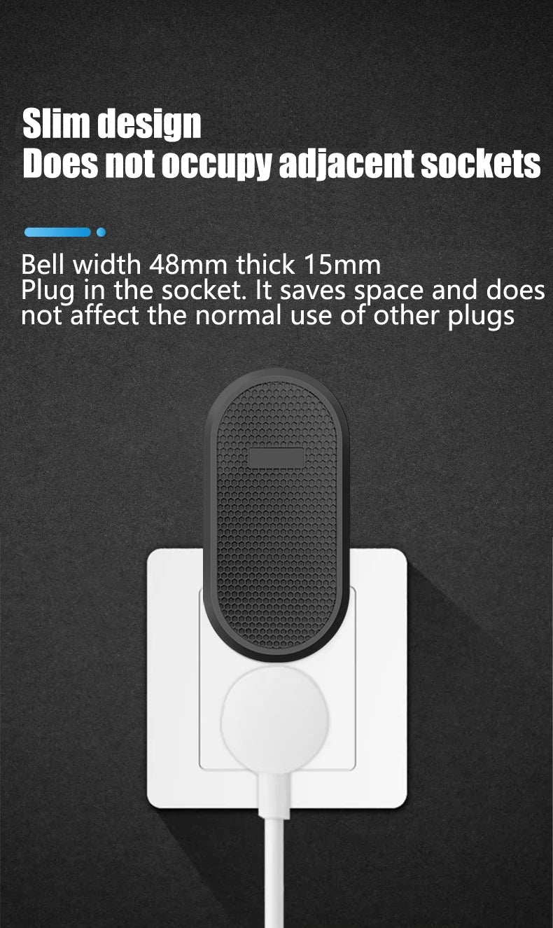 A slim, black oval wireless doorbell receiver plugged into a wall socket, leaving space for other plugs.