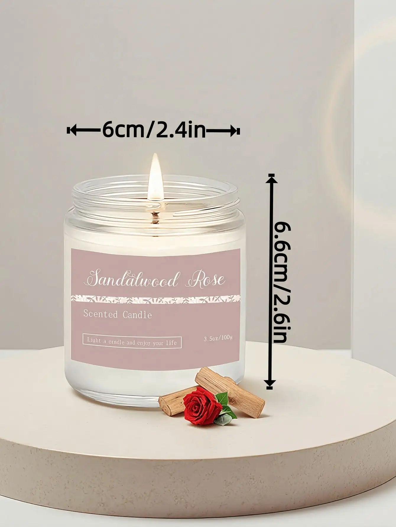 Sandalwood Rose scented candle in a glass jar, measuring 6cm wide by 6.6cm high, with a pink label.