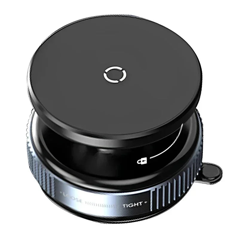Round black magnetic phone mount with a textured, metallic silver base featuring a locking indicator icon.