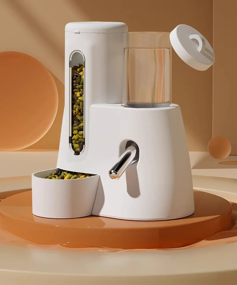 Modern white pet feeder with a transparent grain reservoir, water bottle, metal spout, and integrated feeding bowl.