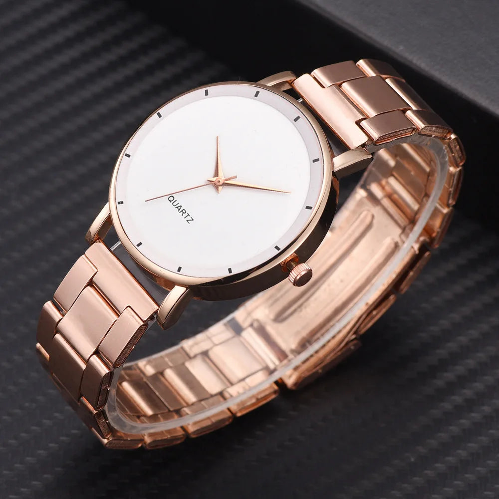 Elegant ladies' rose gold stainless steel watch with a minimalist white face and matching hands.