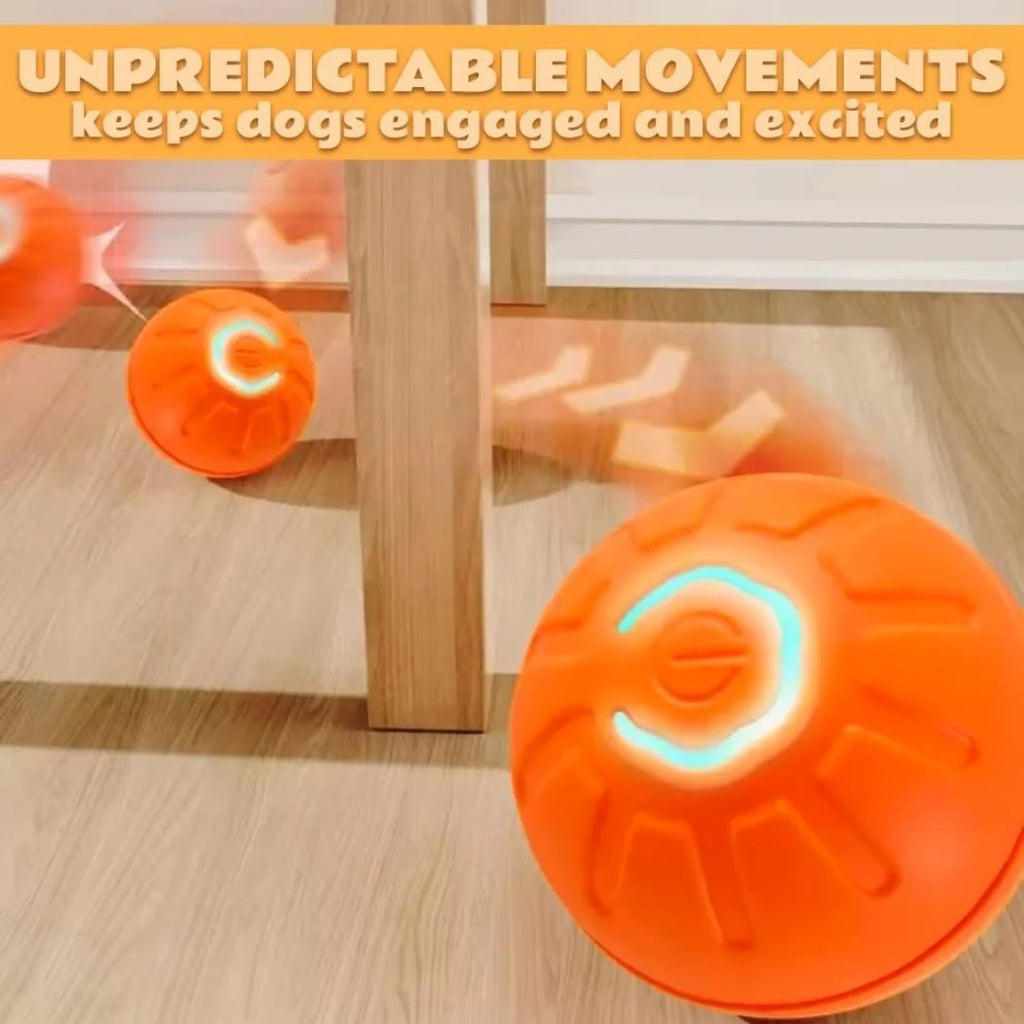 Bright orange interactive electric pet ball toy with glowing light, shown bouncing and rolling on a wooden floor.